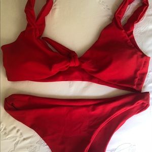 Size medium red bikini with front tie, never worn!
